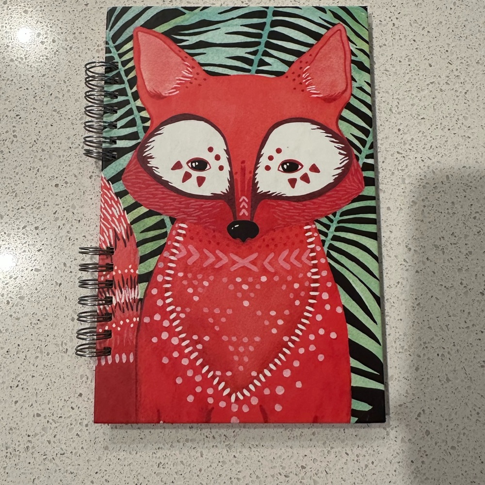 Orange circle studio spiral notebook, woodland creature, fox, pages left shown